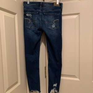 American Eagle ripped blue jeans.